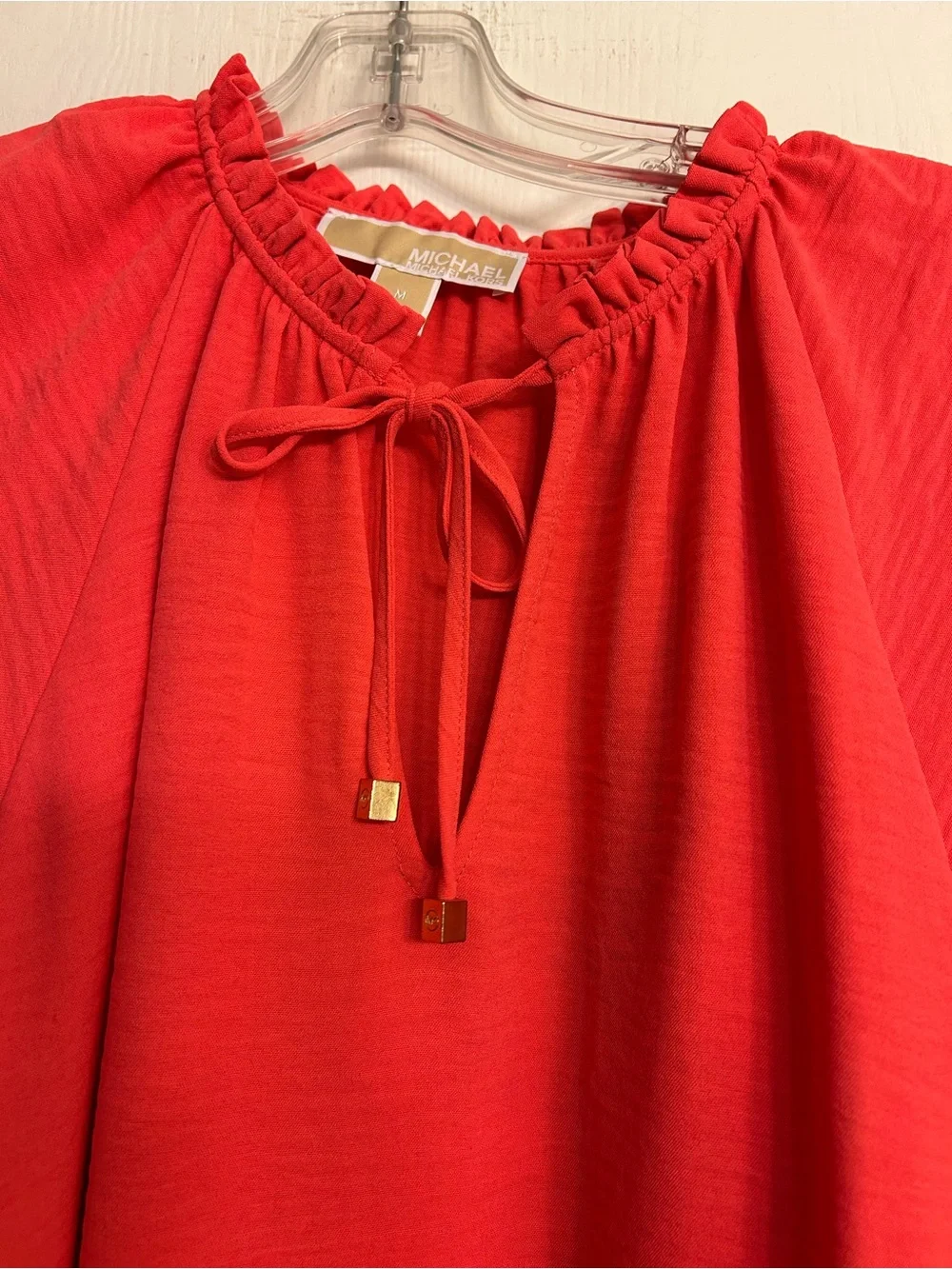 MICHAEL KORS NWOT Bright Coral Ruffle Tie Neck Ladies Cap-Sleeve Blouse Size M.